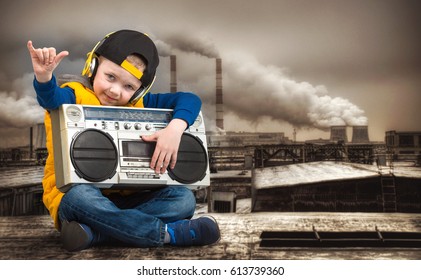 Little Boy In Hip-Hop Listens To The Old Tape Recorder. The Young Rapper.Cool Rap DJ.Vintage Silver Boom Box Radio.Children's Fashion