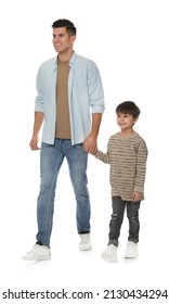 Little boy with his father on white background