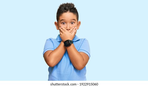 Little boy hispanic kid wearing casual clothes shocked covering mouth with hands for mistake. secret concept. 