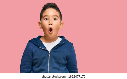 Little Boy Hispanic Kid Wearing Casual Sporty Jacket Scared And Amazed With Open Mouth For Surprise, Disbelief Face 