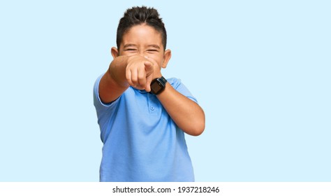 Little Boy Hispanic Kid Wearing Casual Clothes Laughing At You, Pointing Finger To The Camera With Hand Over Mouth, Shame Expression 