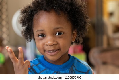 Little Boy Holding Up 3 Fingers