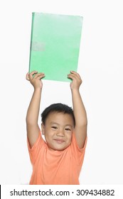 Little Boy Holding A Notebook On White Background