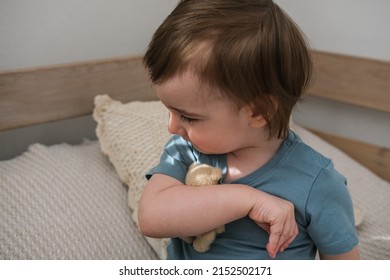 Little boy hugging his favorite toy. Child playing with a teddy bear at home. - Shutterstock ID 2152502171