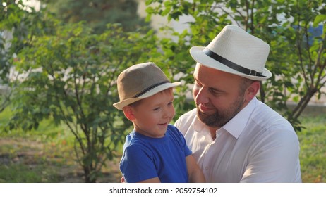 A Little Boy Hugs His Beloved Father, Dad Is In The Arms Of His Son, Happy Family Life, Father's Day, Raising A Kid In Family, Child Life With An Older Parent, Raising Baby As Man, Cheerful Childhood