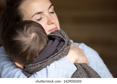 Little boy hugs his mother tightly hugging. Son hugging his mother. Family concept.