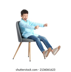 Little Boy With Imaginary Steering Wheel Sitting In Chair On White Background