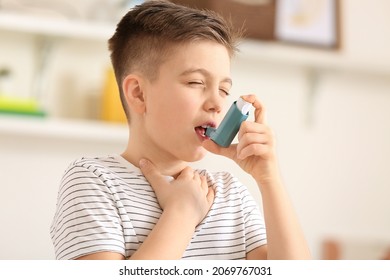 Little Boy With Inhaler Having Asthma Attack At Home