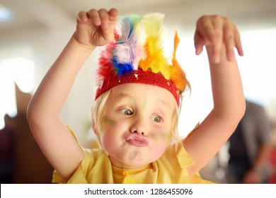 Little Boy Involved In Performance Children's Theatre Studio In The Role Of The American Indian. Child Perform Kids Playing On Stage In Theater.