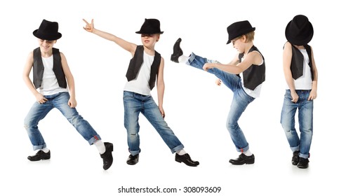 Little boy in jeance and hat is dancing on white