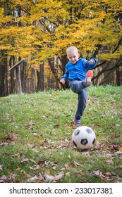 Little Boy Kicking Ball