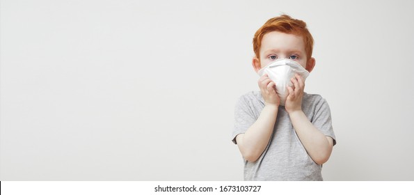 Little Boy, Kid, Baby Or Children Trying To Stay Healthy By Wearing A Mask To Protect Him Against Corona Virus Covid -19 And 2019-nCov. Concept: Sick Of Covid, Isolated On White, Missing Family. 


