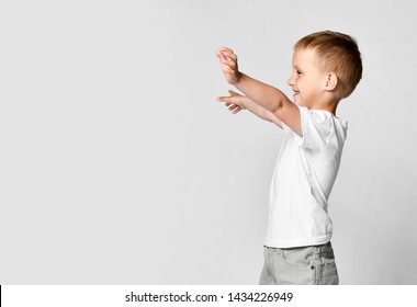 Little Boy Kid Shows Hugs With Open Arms Side View