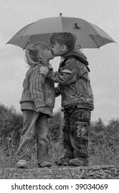 Little Boy Kiss Girl, Under Umbrella In Autumn Day