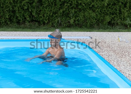 Similar – Ein Mann mit Sonnenhut und einer gelben Gummiente in einem Pool.