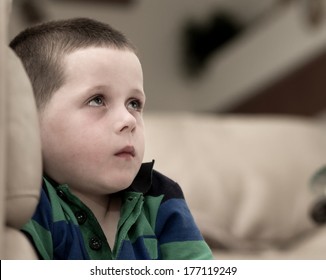 little boy with a look of fear upon his face