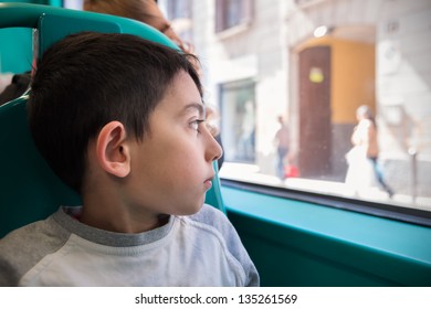 Little Boy Looking Through The School Bus Window