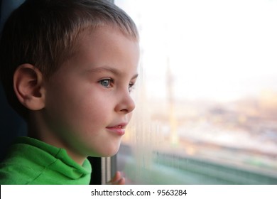 Little Boy Looks In Train`s Window