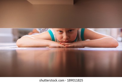 Little Boy Looks Under The Bed