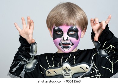 Little Boy Making Face Painting. Halloween