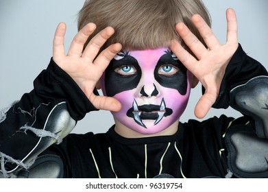 Little Boy Making Face Painting. Halloween