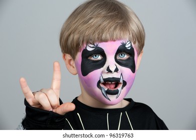 Little Boy Making Face Painting. Halloween