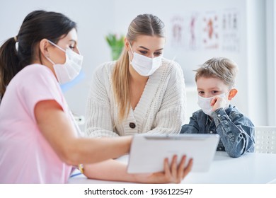 Little boy in mask having medical examination by pediatrician covid-19 concept - Powered by Shutterstock