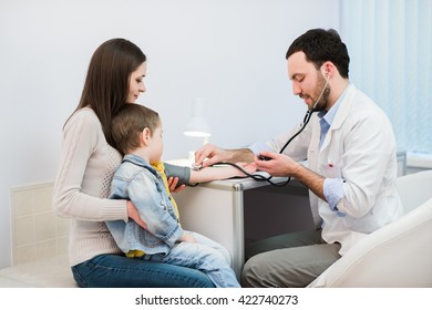 Little Boy Medical Visit - Doctor Measuring Blood Pressure Of A Child