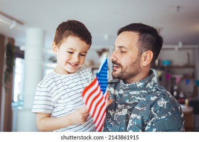 Little boy meeting his military father at home. Memorial Day celebration. An emotional military father, dressed in camouflage, holds his young son in arms in greeting after returning home
 - Powered by Shutterstock