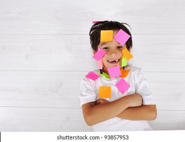 Little boy with memo posts on his face - Powered by Shutterstock