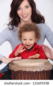 Little Boy And Mother Playing Bongo Drum