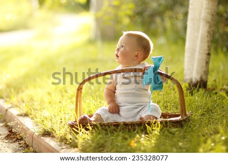 a little boy near the basket to nature