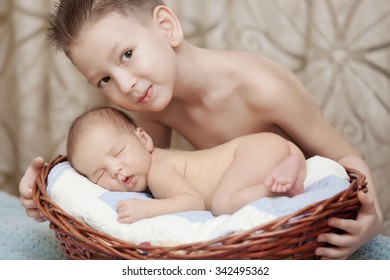 Little boy near his newborn brother