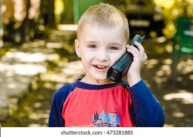 Little Boy And Phone