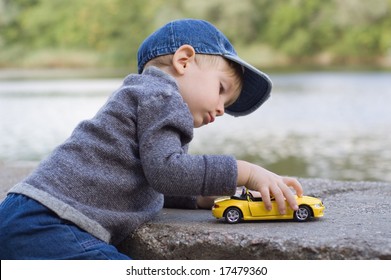 boy with toy car