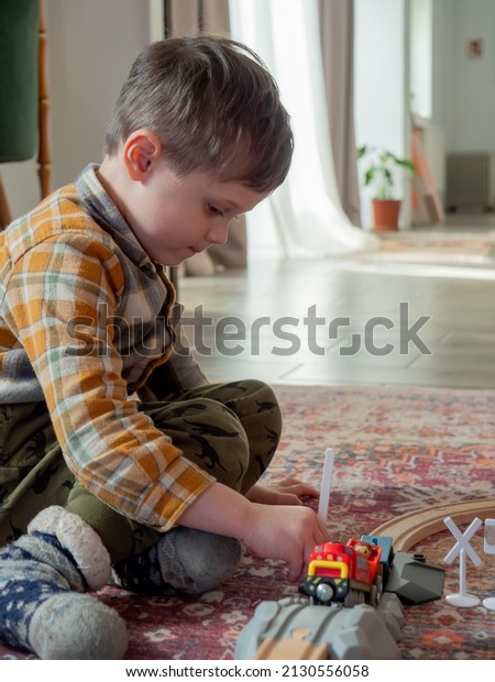 Little boy play in\
train in room at home 