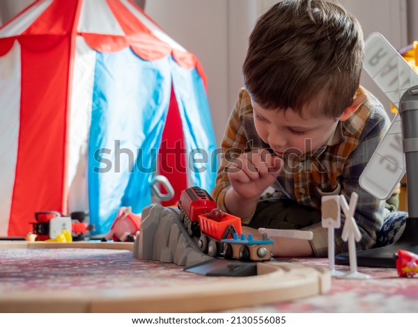 Little boy play in\
train in room at home 