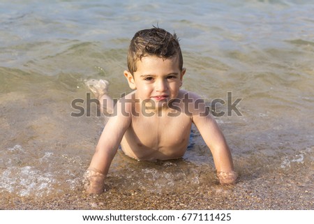 Similar – Image, Stock Photo Little boy doing exercise at beach