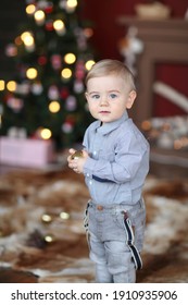 Little Boy Playing With Christmas Tree Toys