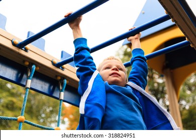 Little Boy Playing On Monkey Bars In Autumn, Kids Sport