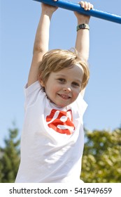 Little Boy Playing On Monkey Bars In Summer, Kids Sport