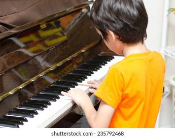 Little Boy Playing Piano