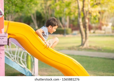 Little boy playing in the playground outdoor
