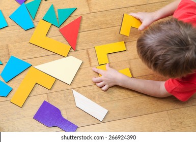 little boy playing with puzzle, early education concept