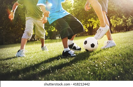 Little Boy Playing Soccer With His Father Concept - Shutterstock ID 418212442
