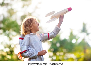 Little Boy Playing With Spaceship. Astronaut Costume For Halloween Party. Creative Child With Space Rocket. Kids Dream And Imagine. Role Play For Children. Future And Freedom Concept.