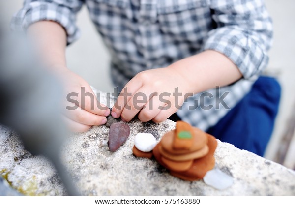 Little Boy Playing Little Stones Outdoors Stock Photo 575463880 ...