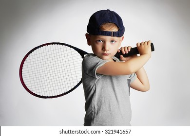 Little Boy Playing Tennis. Sport kids.Child with Tennis Racket.healthy children