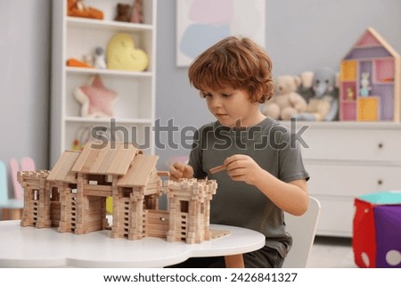 Similar – Image, Stock Photo Gating | boy in profile | be all ears.