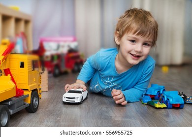 niños jugando con carritos